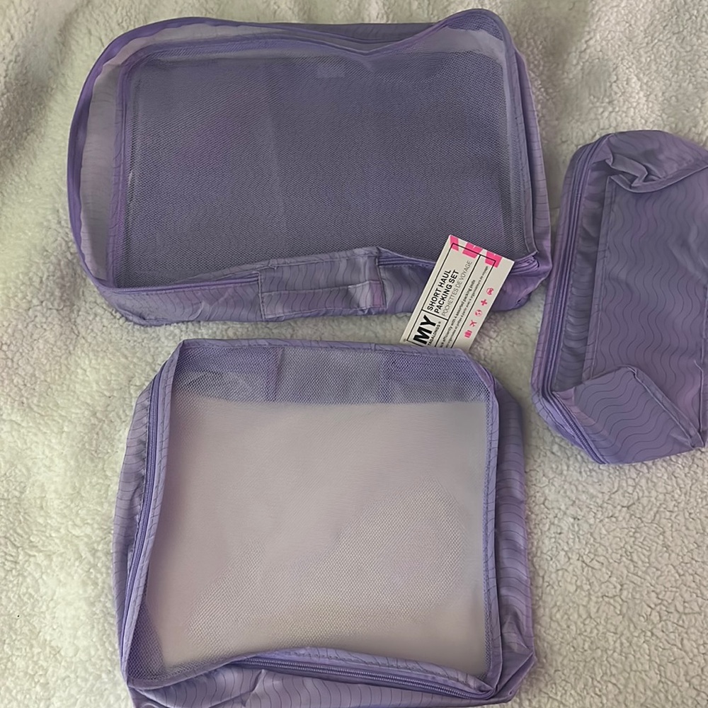 Brand New with tags 4 peace travel, set, purple!! from fab fit fun!!!